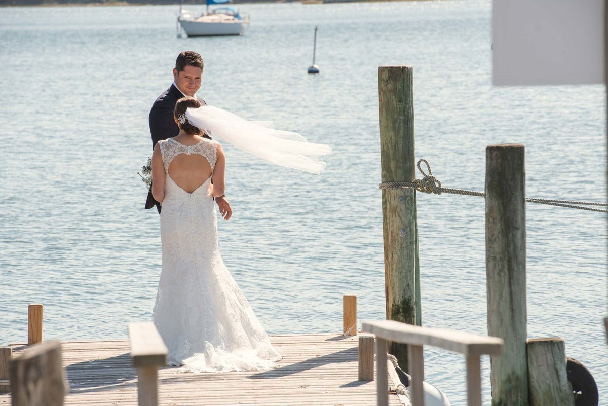 Bride and groom on the dock at The Ram's Head Inn