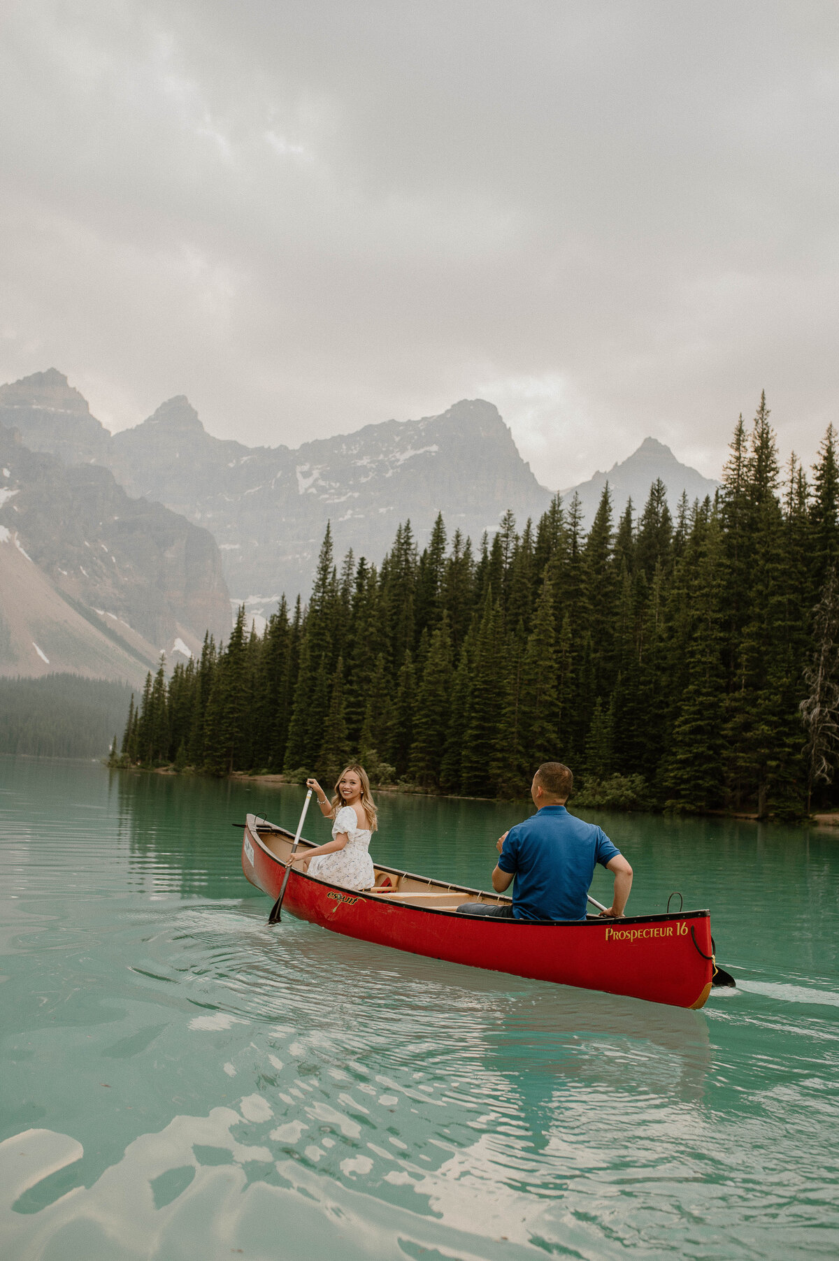 canoeing engagement couple on Moraine Lake in Banff