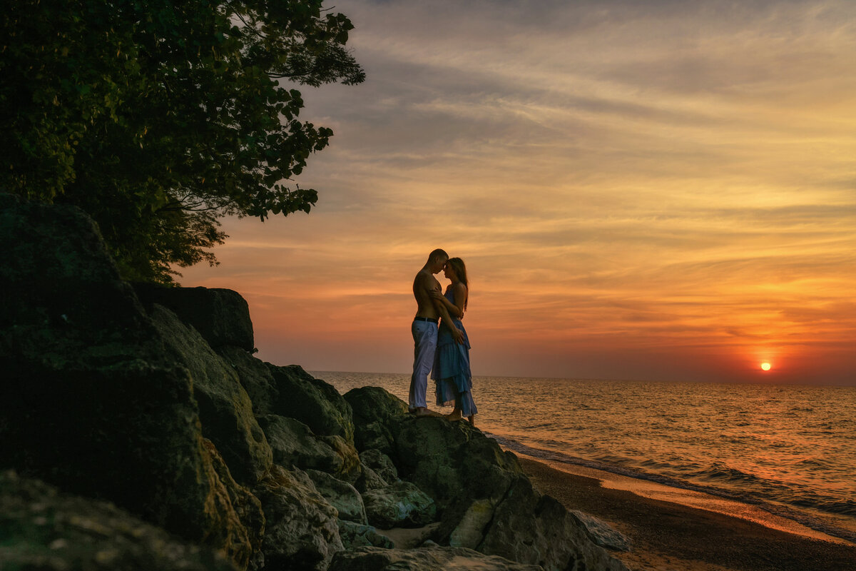 Gorgeous picture of newly engaged couple during sunset at Indiana Dunes beach