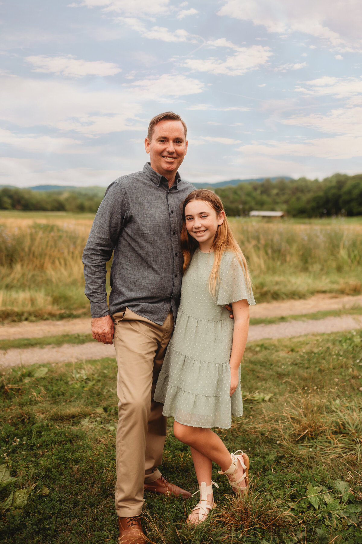 Father poses with his daughter for Portraits during an Extended Family Photoshoot in Asheville, NC.