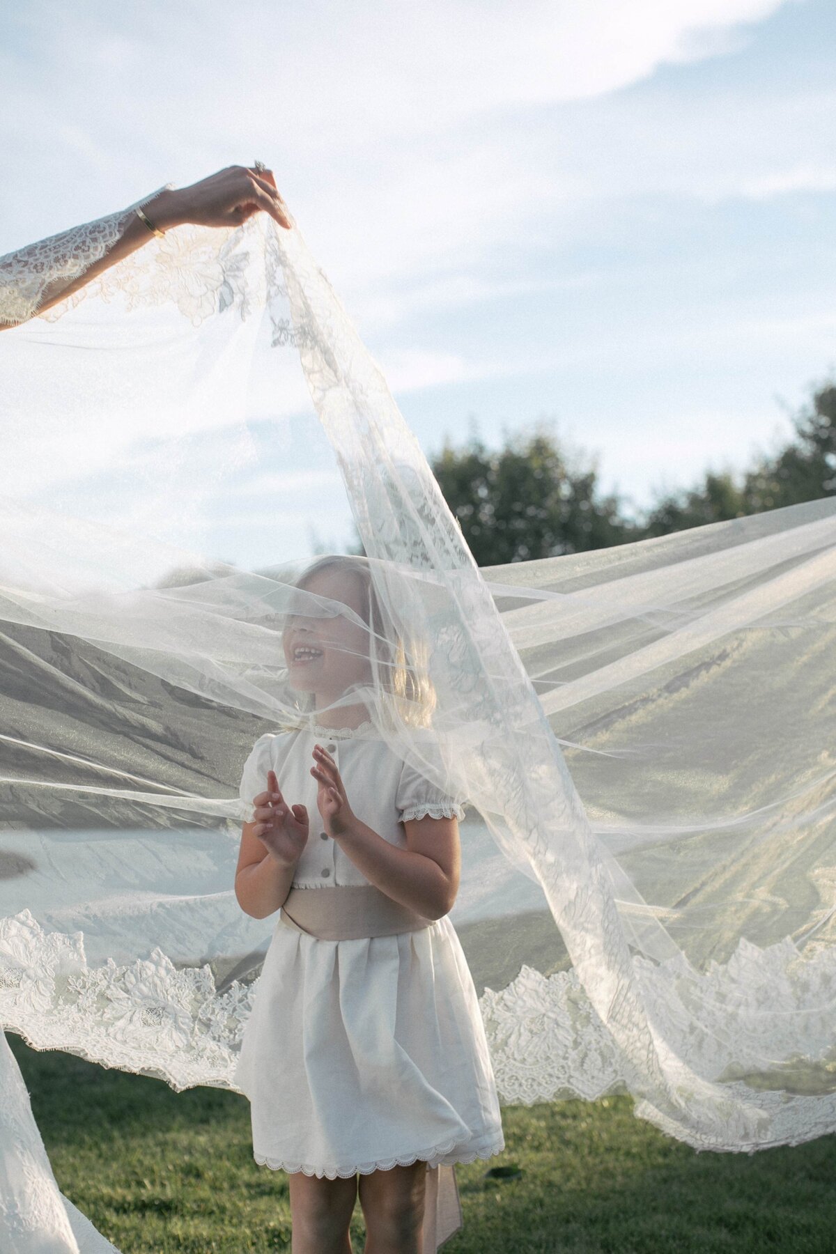 Flower Girl Under Wedding Veil at Nantucket Estate Wedding