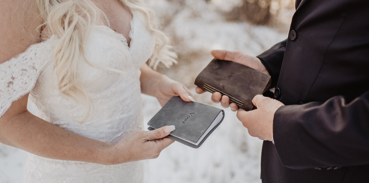 Jackson Hole Photographers capture couple holding vow books
