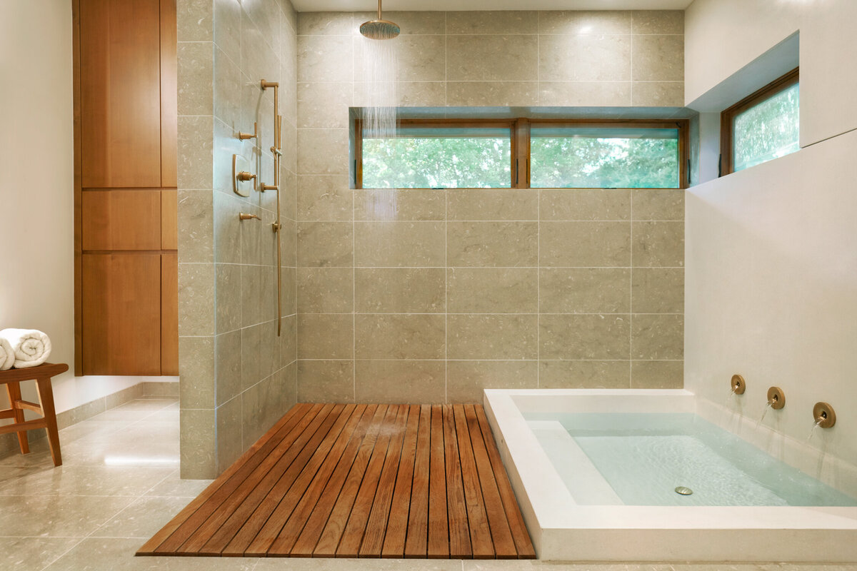 Panageries Residential Interior Design | Pacific NW Modern Dwelling Master Bath with wooden paneling leading to the shower and the tub
