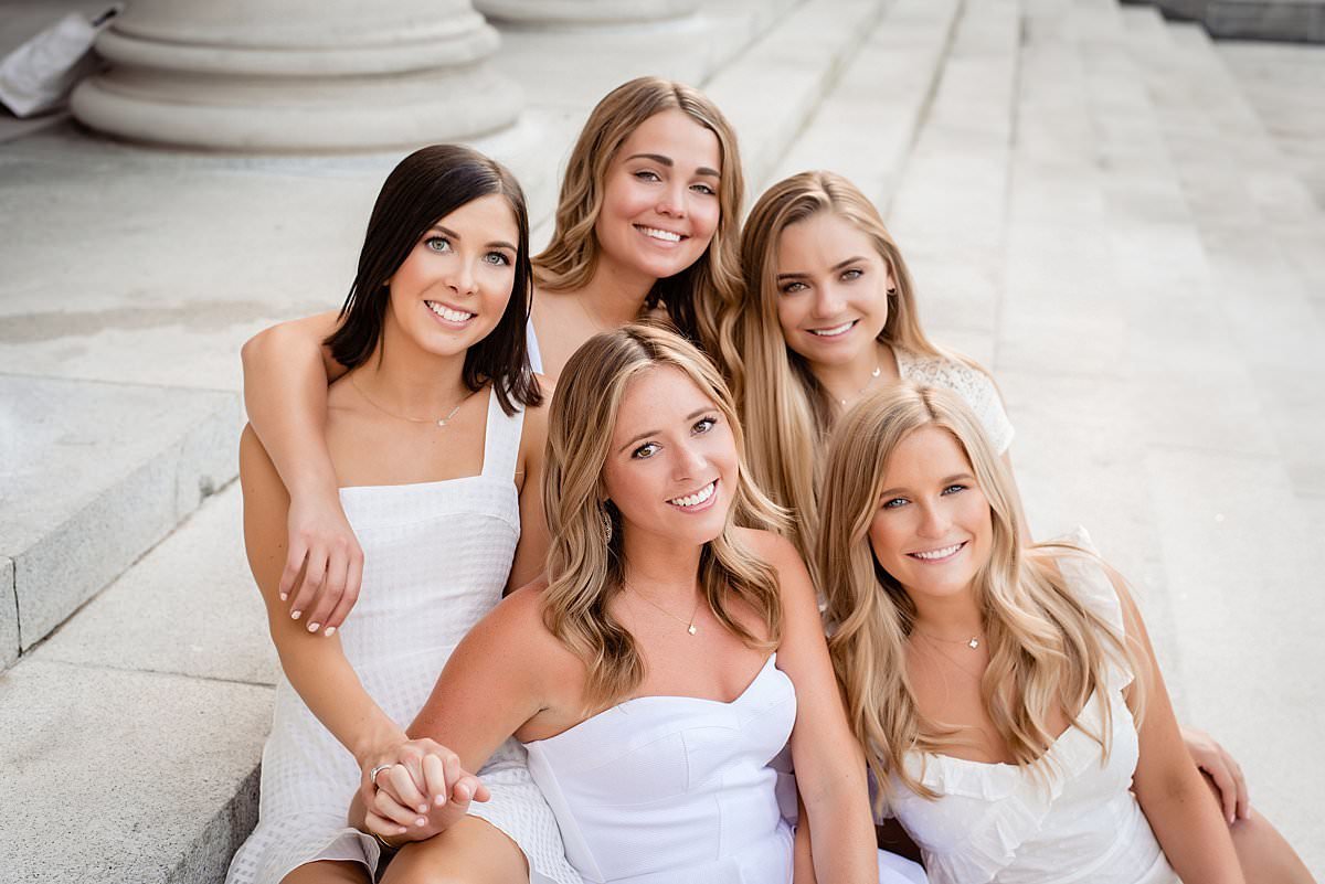 5 Vanderbilt senior girls sitting together and smiling at camera
