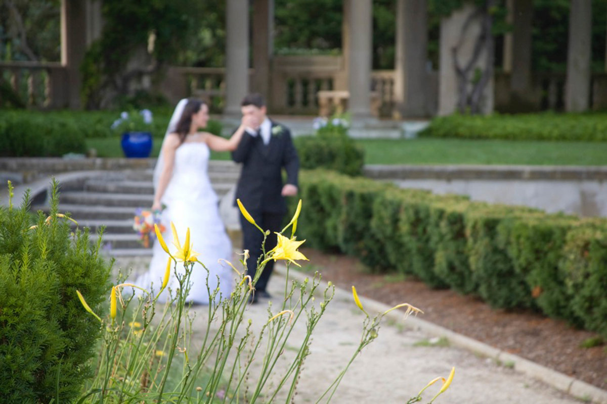 Bride and groom walking down a pathway