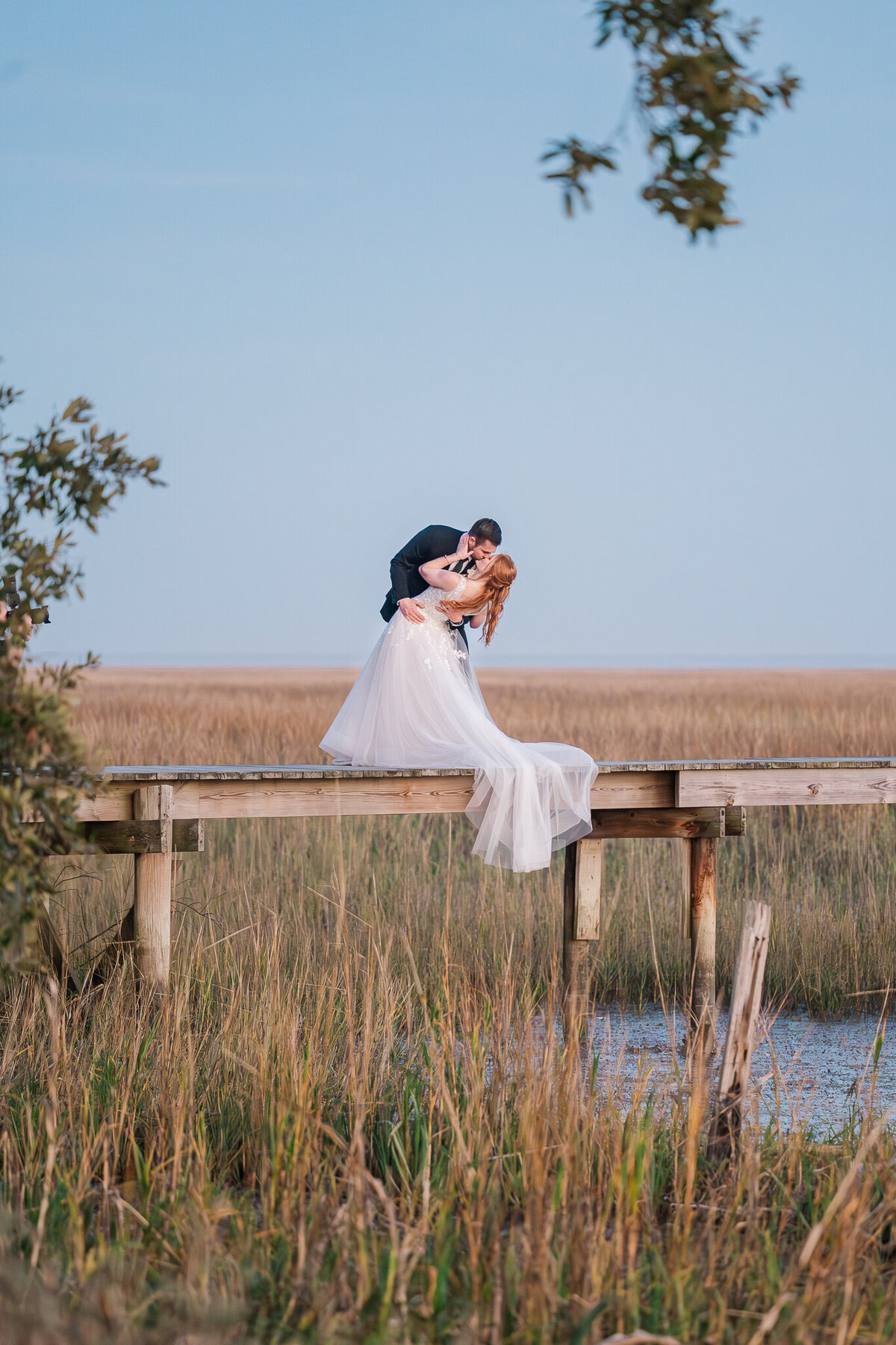 Sunset kisses on the Wilmington intercoastal waterways at sunset on a warm winter day by Wilmington wedding photographer, JoLynn Photography