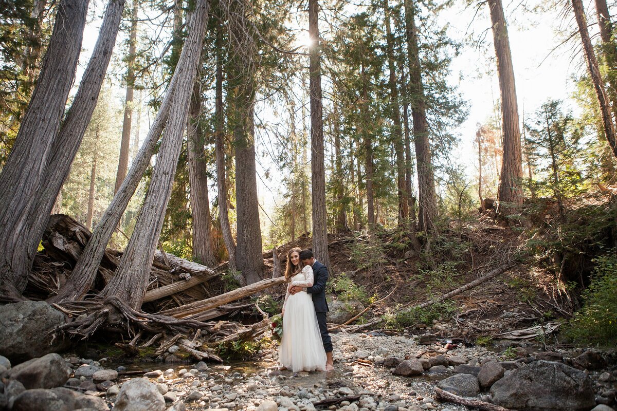 sweet couple embracing in the woods