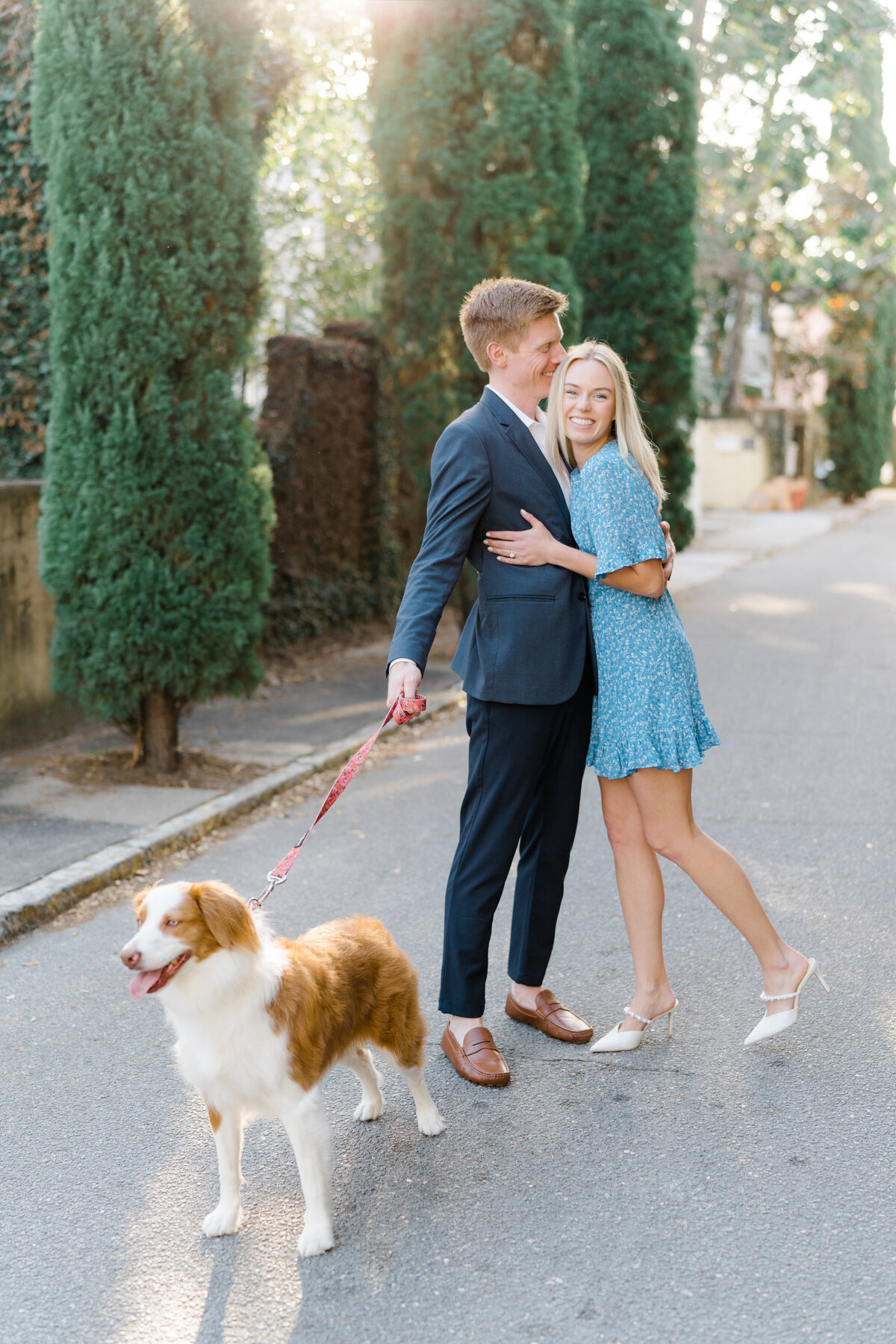 This couple brought their australian shepherd dog to their sunshine filled engagement session in downtown Charleston.