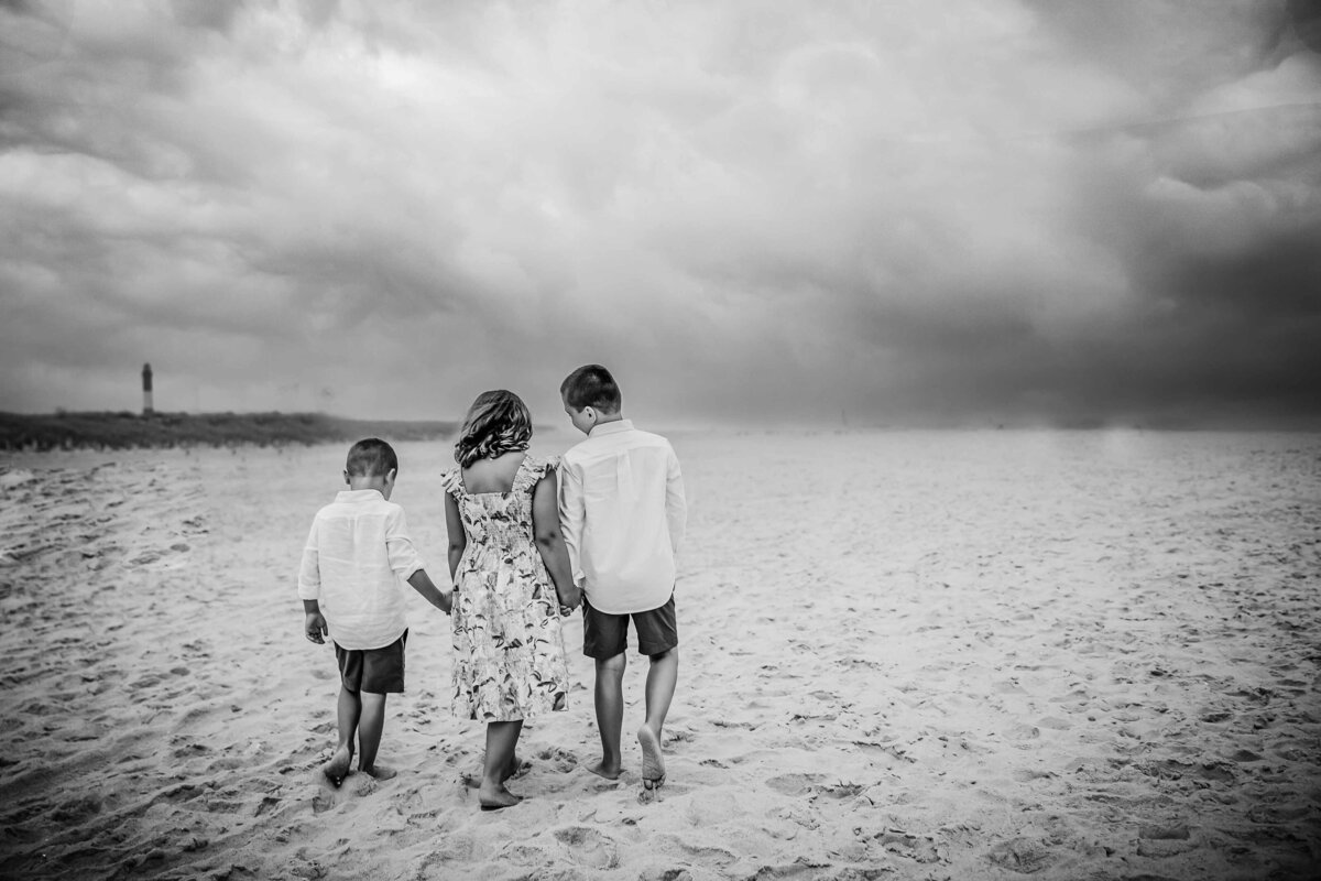 siblings walking on beach long island family photography