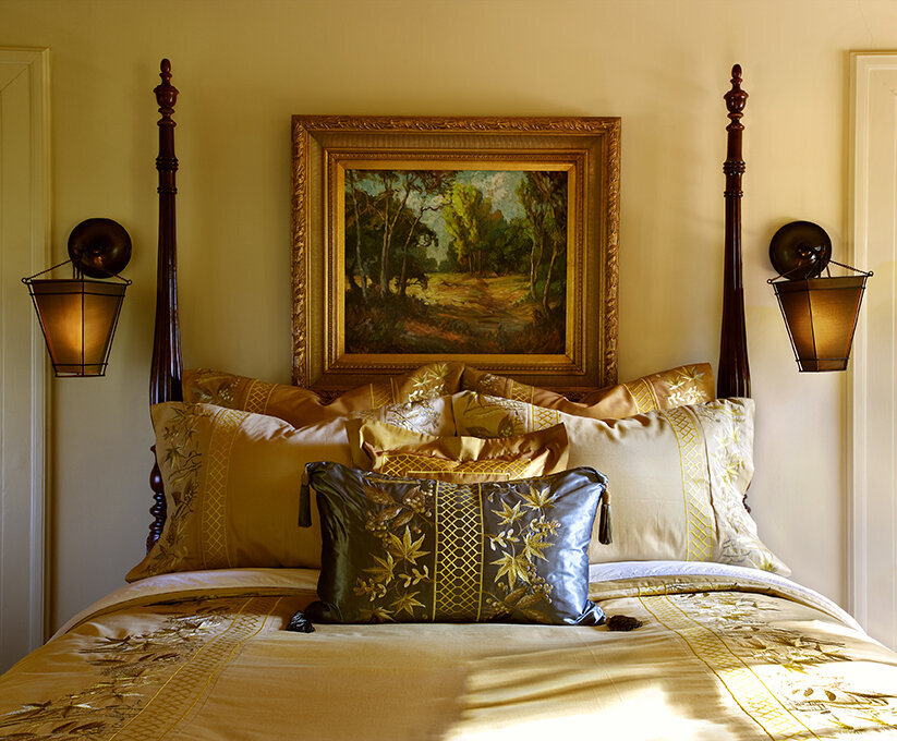 Panageries Residential Interior Design | Tudor Revival Estate Bed furnished with Fluffy Pillows, Artwork and Sconces