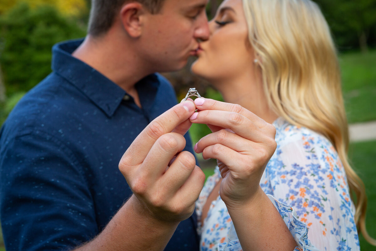 engagement-couple-holding-ring-kissing-nj