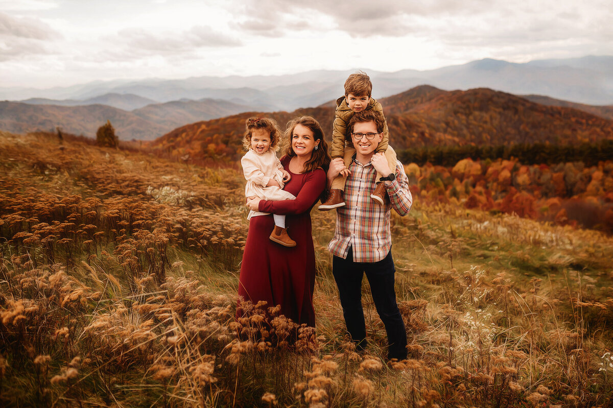 Family poses for Portraits during Family Photoshoot at Max Patch in Asheville, NC.