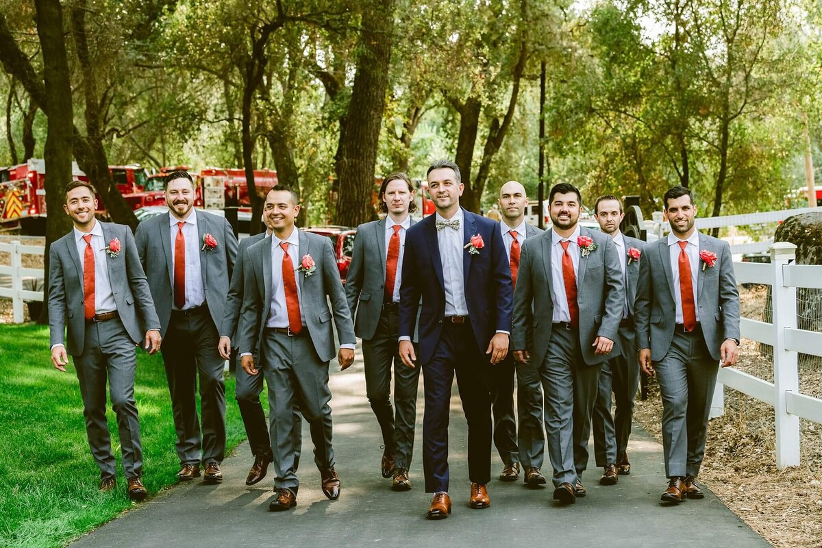 groom and groomsmen walking 