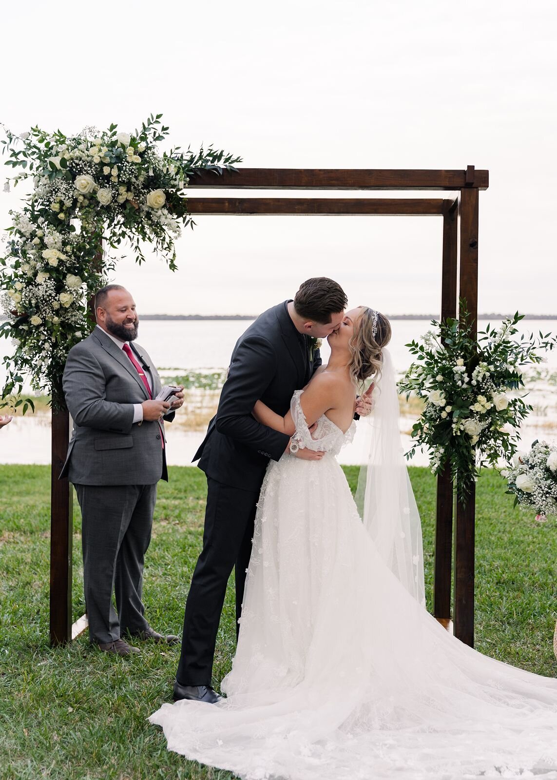 Groom and Bride first kiss wedding Ceremony at Bella Cosa, Lake Wales, Florida