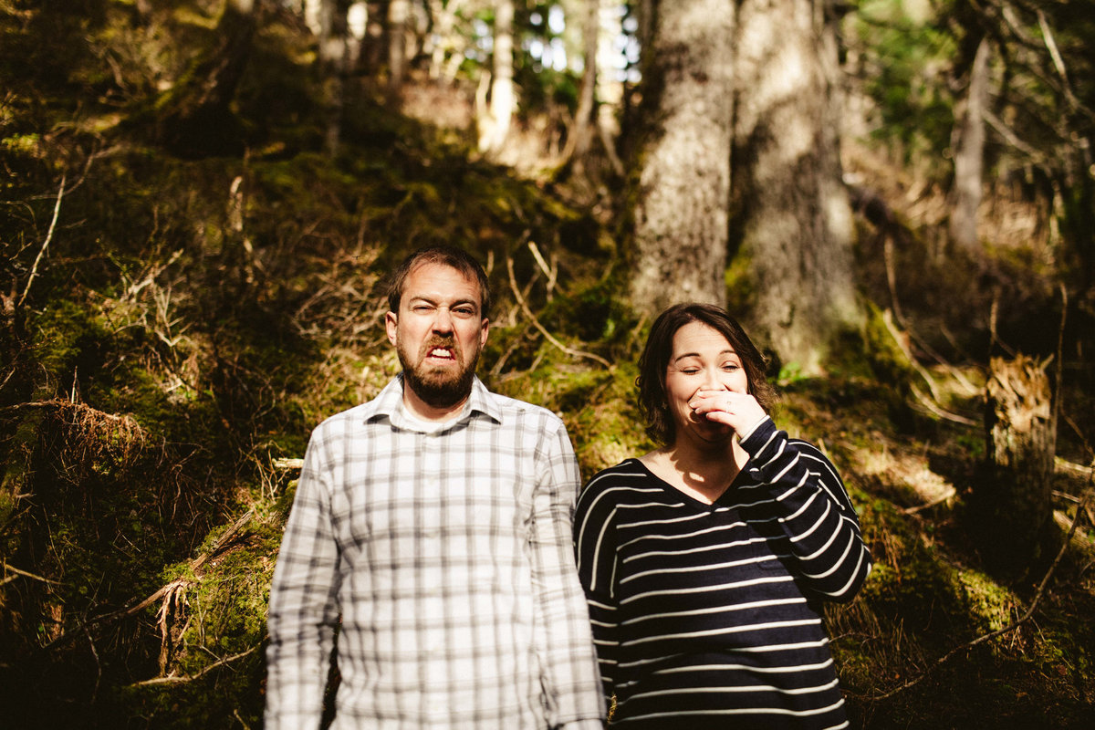 couple making funny faces in girdwood forest