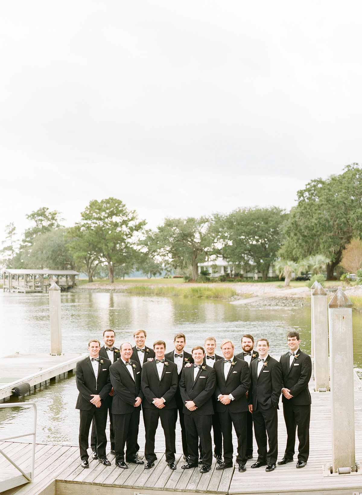 Southern Groom and Groomsmen in Black Tuxedos on Dock at Private Wadmalaw Estate