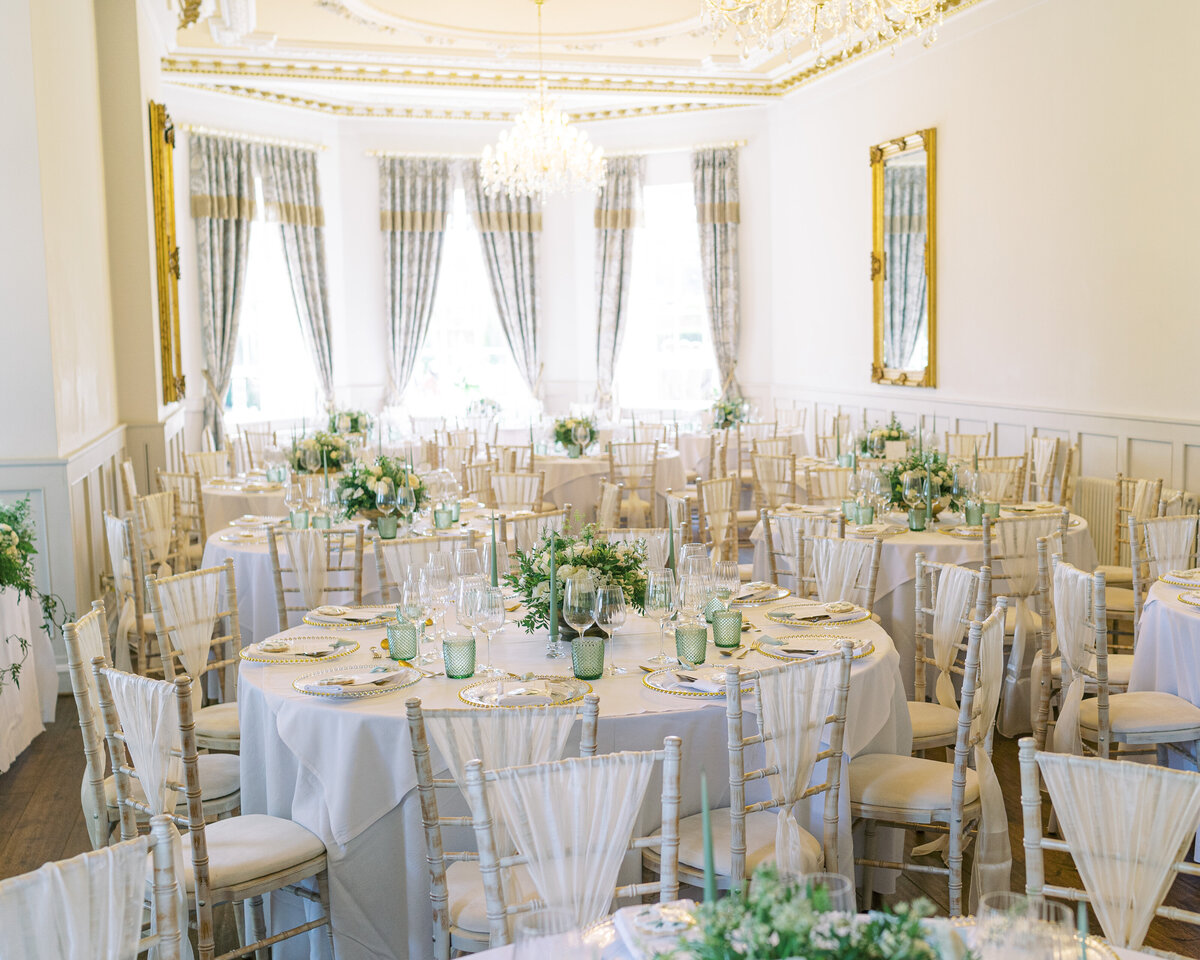 Beautiful wedding breakfast setup with white flowers at Bourton Hall wedding venue