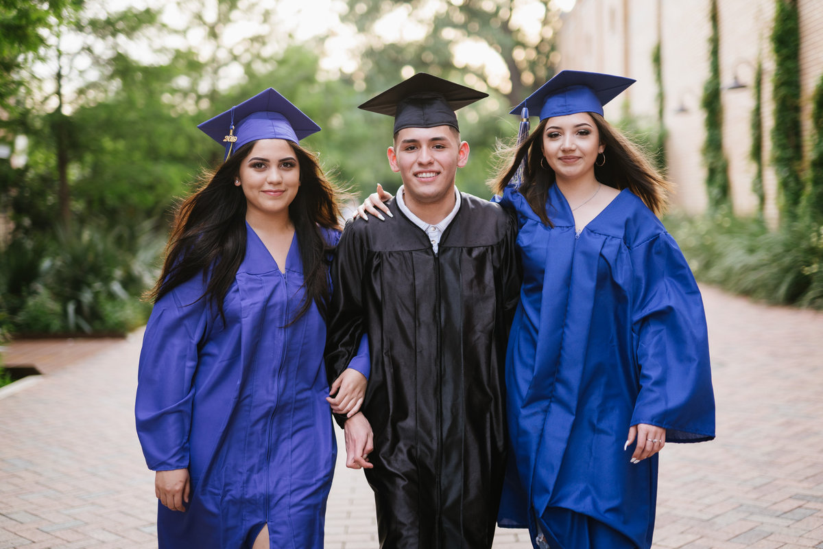 three high school seniors walking in San Antonio by high school senior photographer