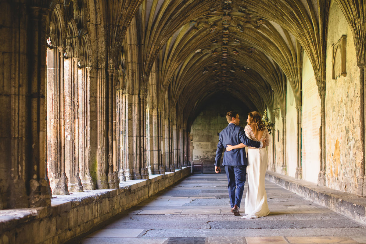 bride and groom walking after wedding at canterbury cathedral