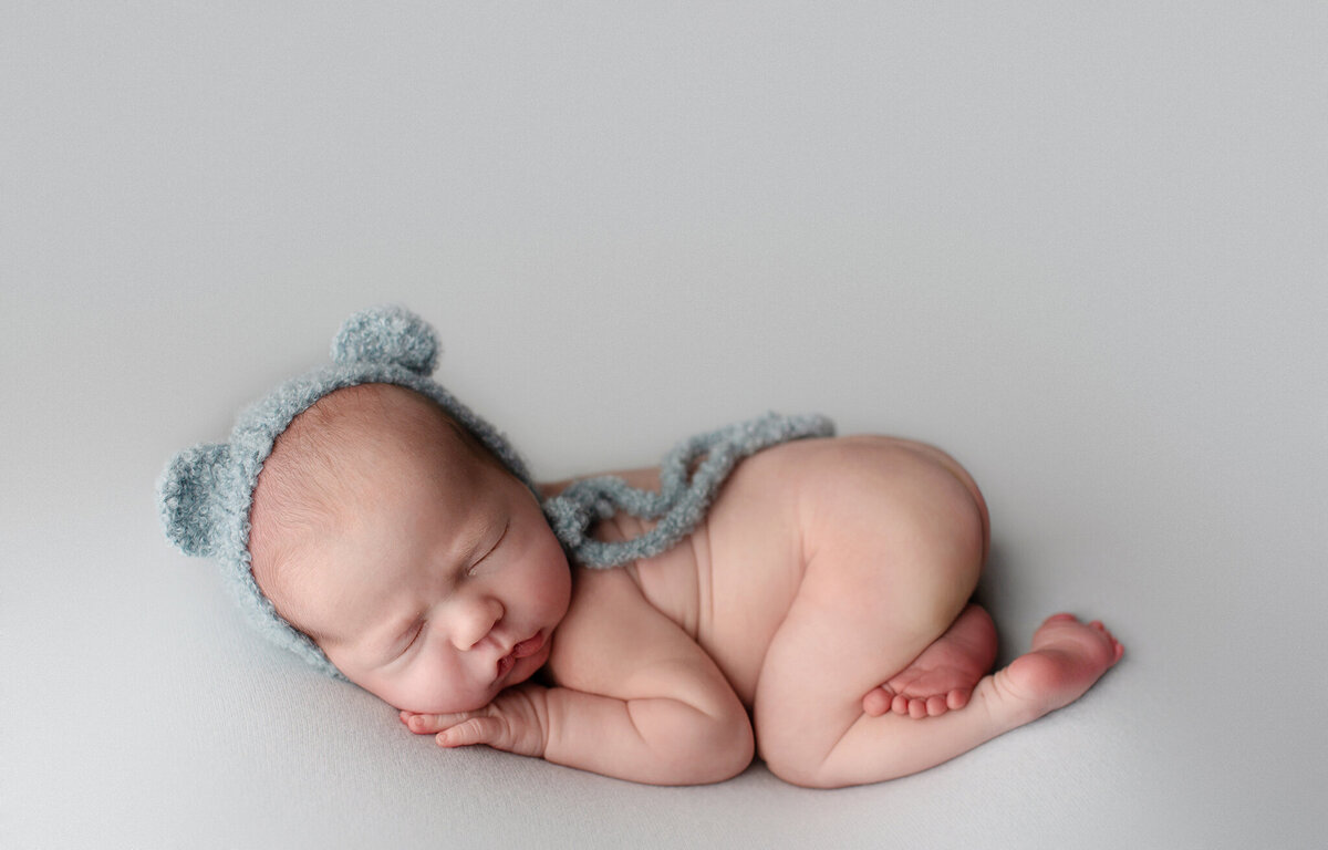 photos of baby boy ona blue fabric for his boulder newborn photos