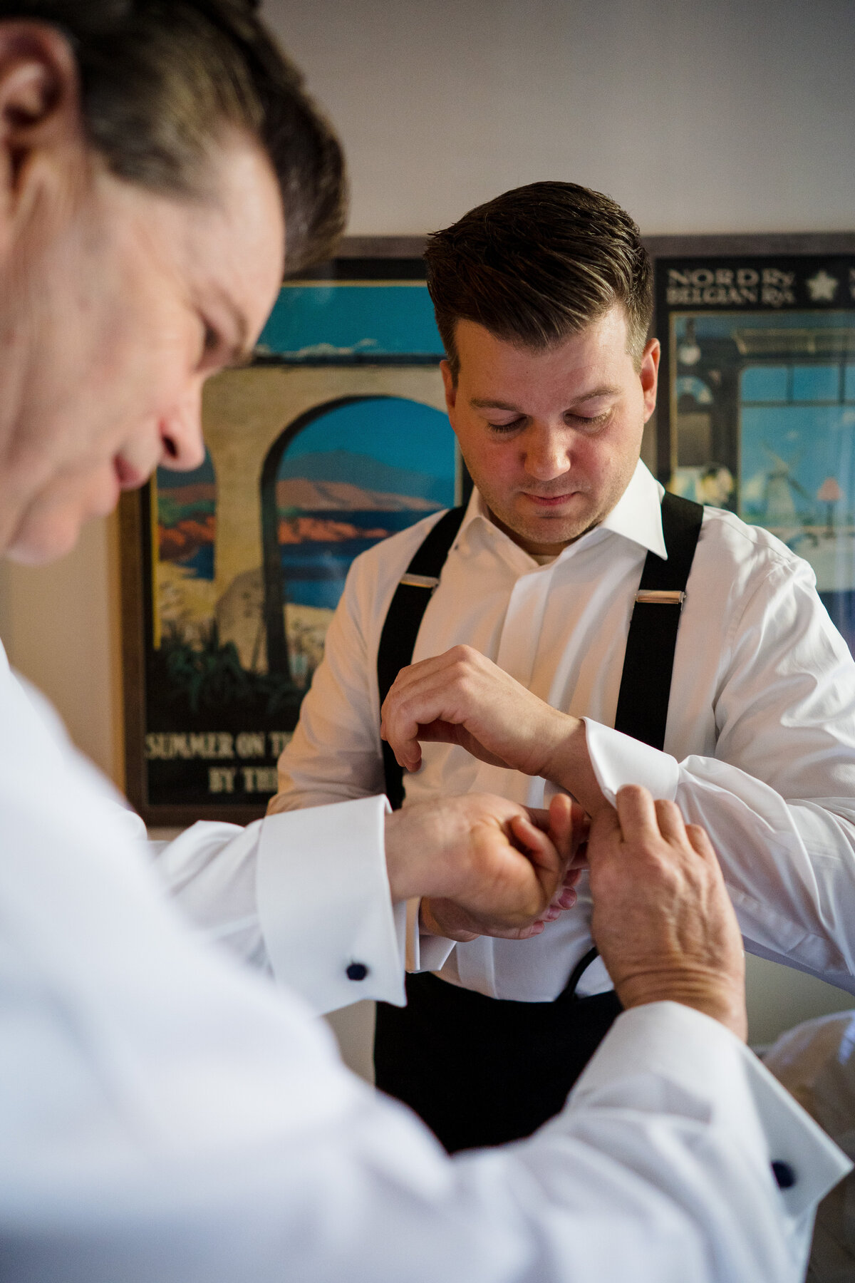 groom-getting-ready-cufflink-help