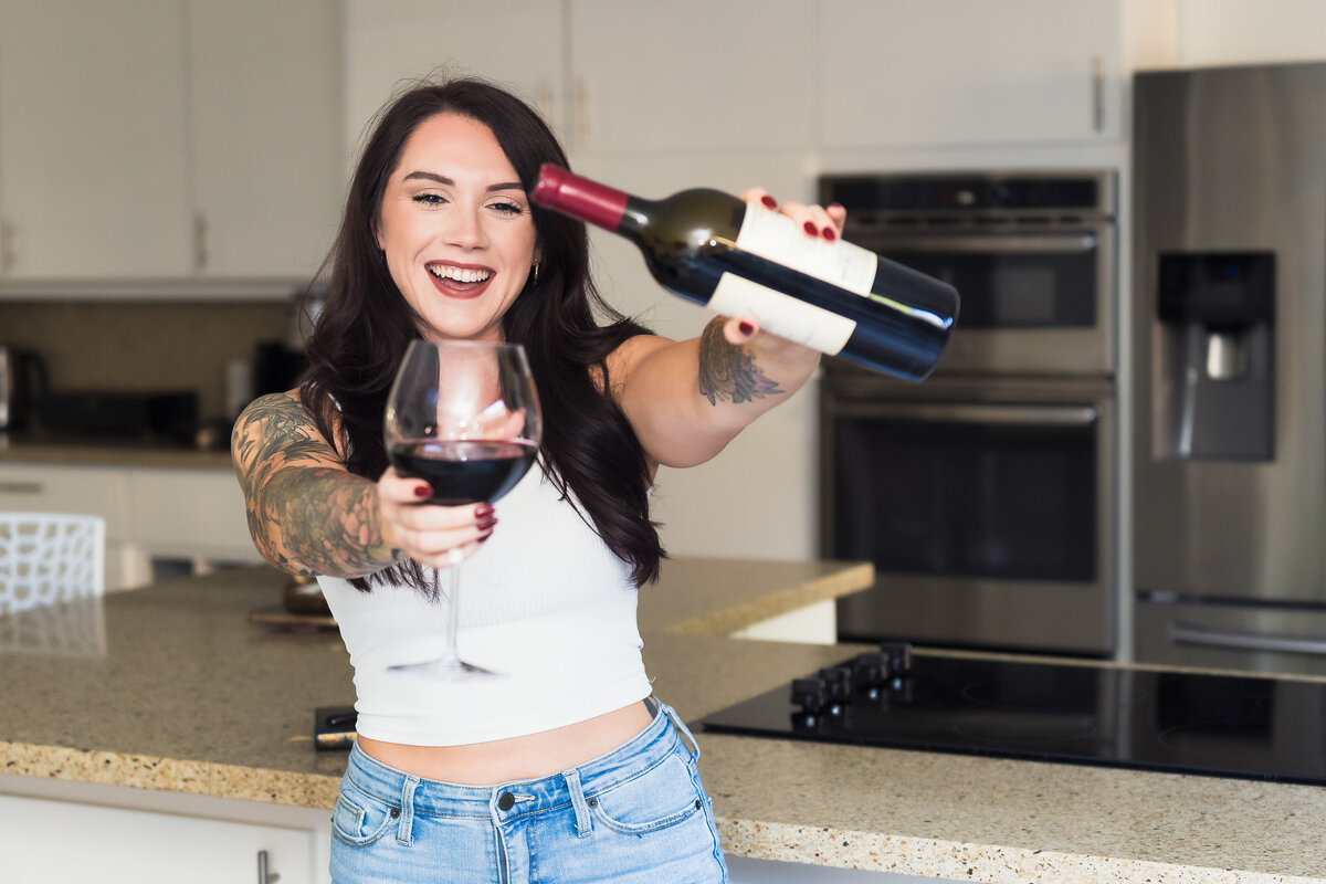 brand photo of a fitness coach celebrating with a bottle of wine