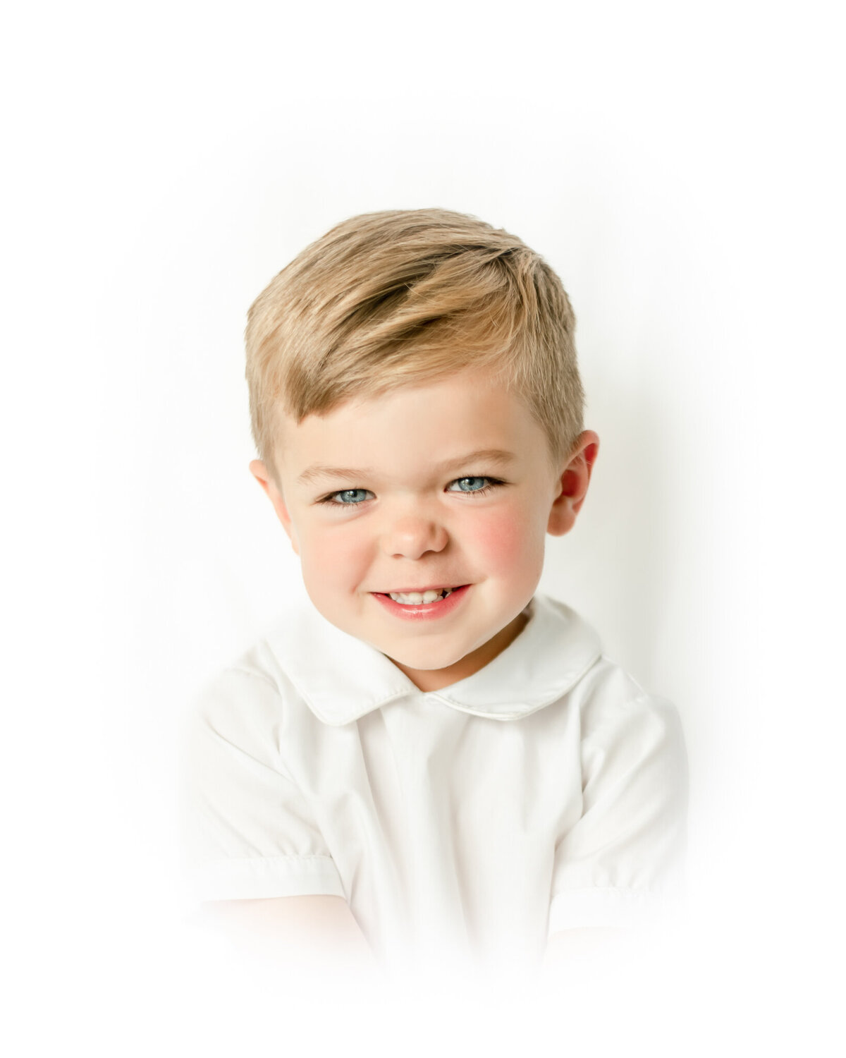 Vignetted portrait of a brown haired little boy