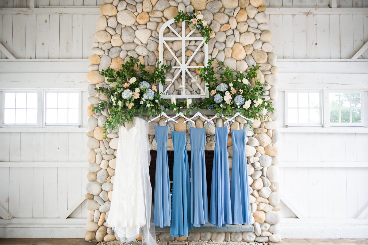 blue bridesmaid dressed hung on mantel