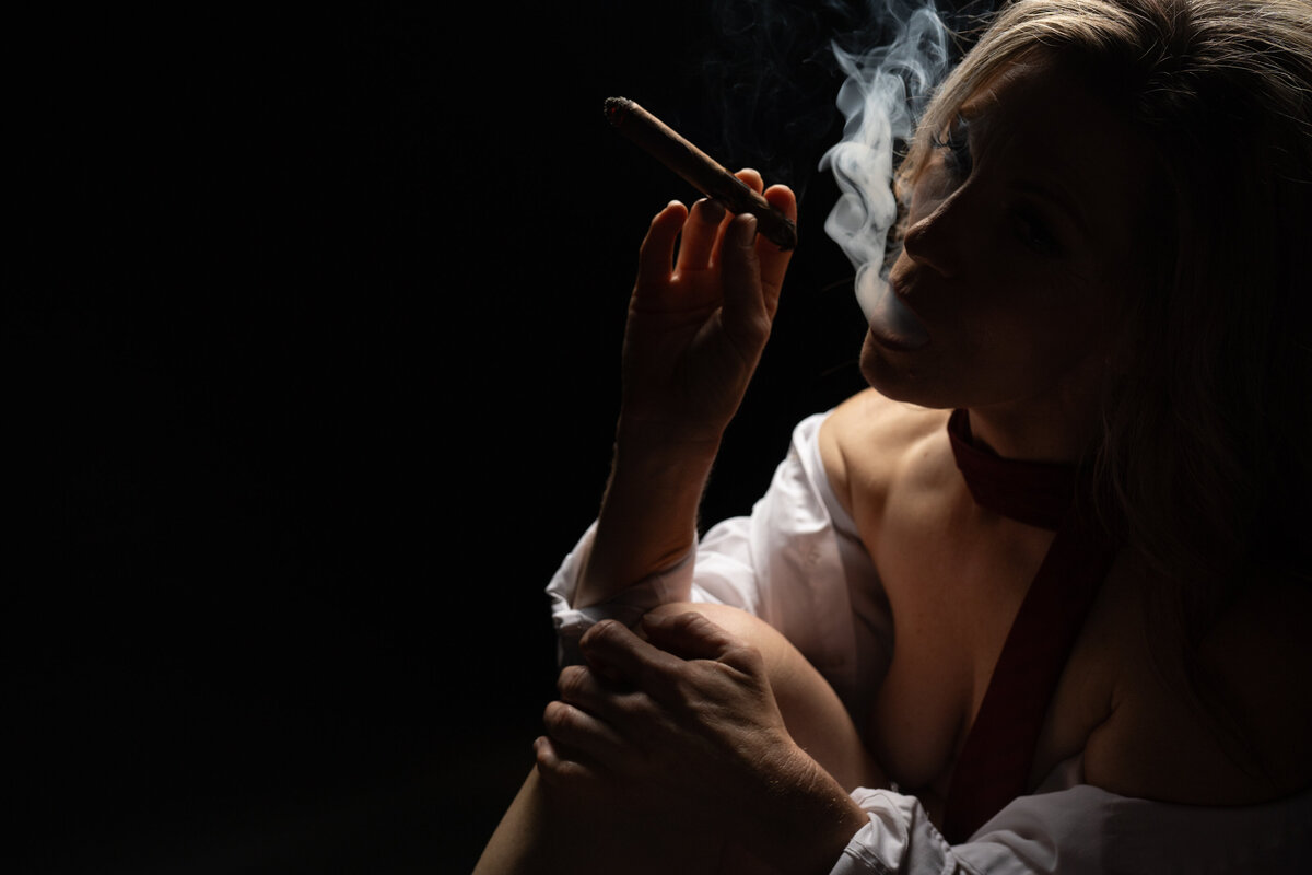 woman smoking cigar