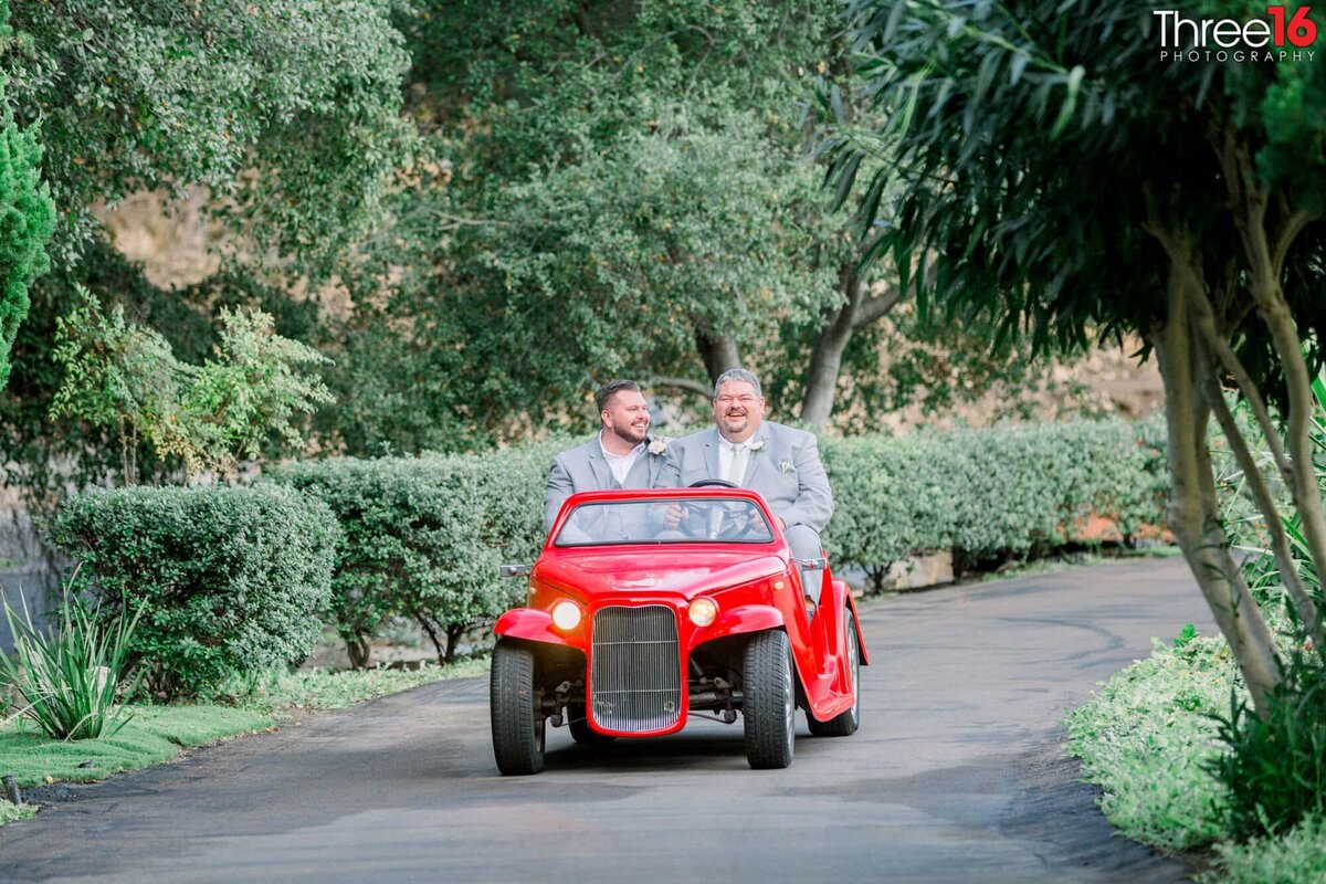 Groom and Best Man drive in together in a small red car replica from ZZ Top's Sharp Dressed Man video