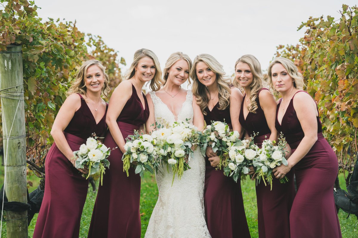 photo of bridesmaids with bride in the vineyards at The Vineyards at Aquebogue