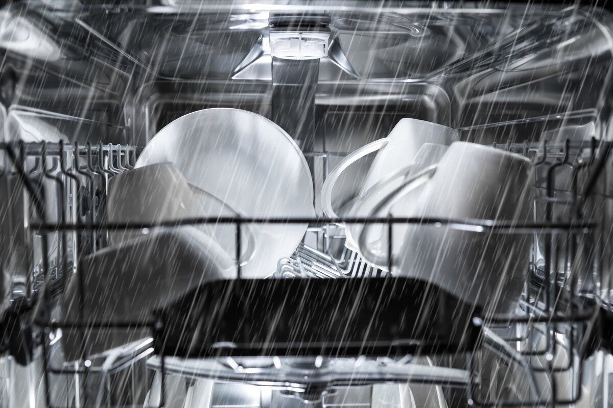 wet dishes inside of a dishwasher