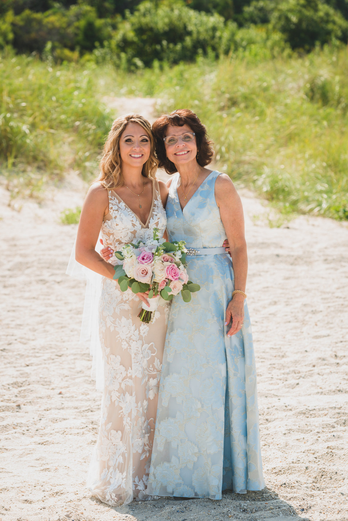 photo of bride with mom on the beach from wedding at Pavilion at Sunken Meadow