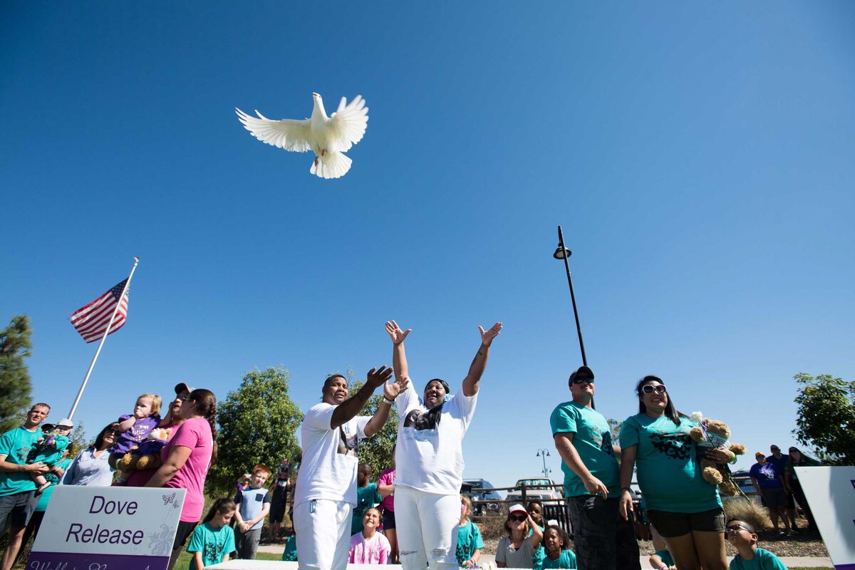 A dove release at and empty cradle event in San Diego