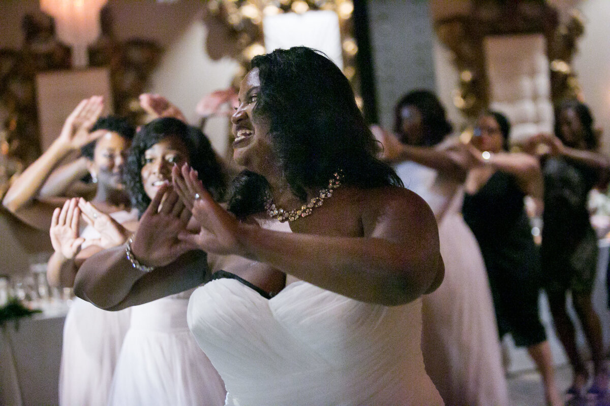 Bride dances with her guests at the elegant Caramel Room in St Louis.