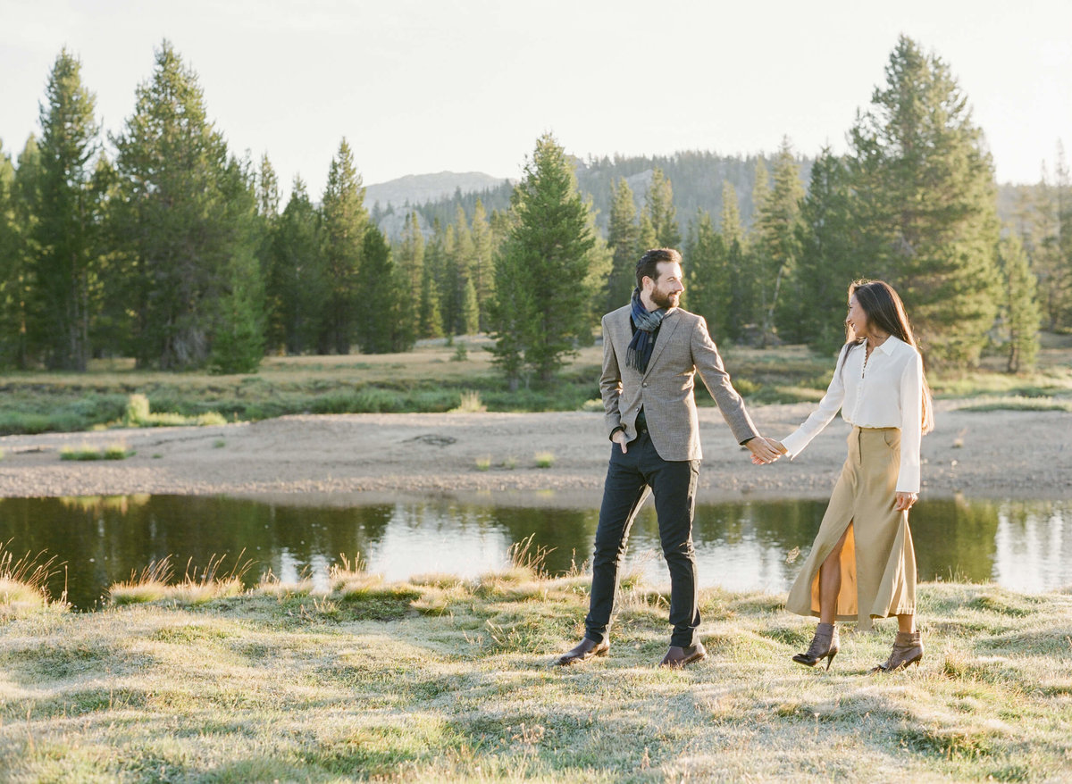 23-KTMerry-destination-engagement-session-Yosemite-couple-walking