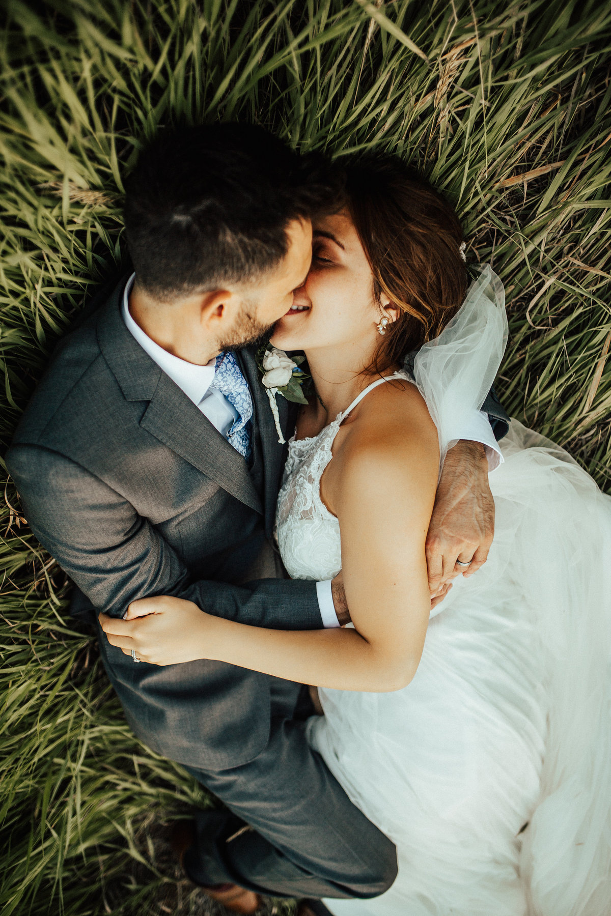 couple in grass hugging