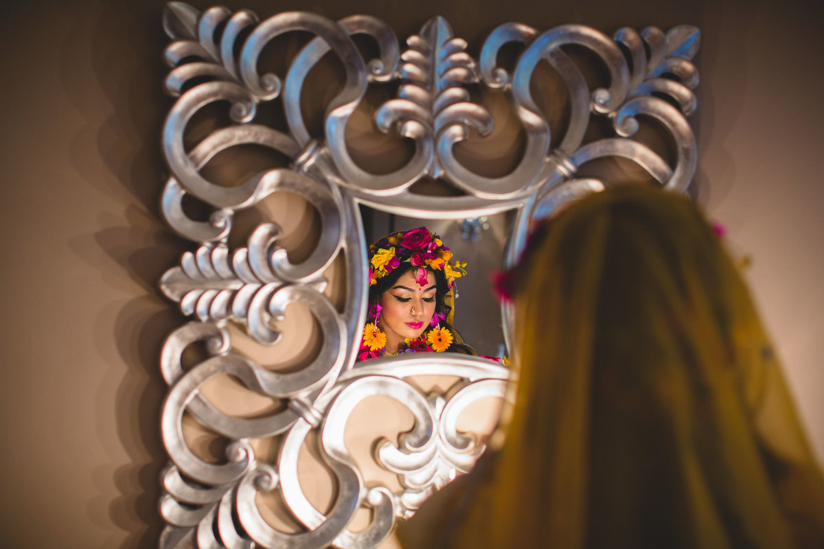 asian bride looking in mirror