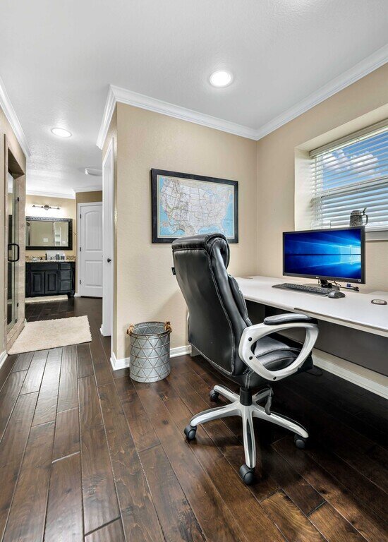 Office with desk space in this four-bedroom, four-bathroom vacation rental home and guest house with free WiFi, fully equipped kitchen, firepit and room for 10 in Waco, TX.