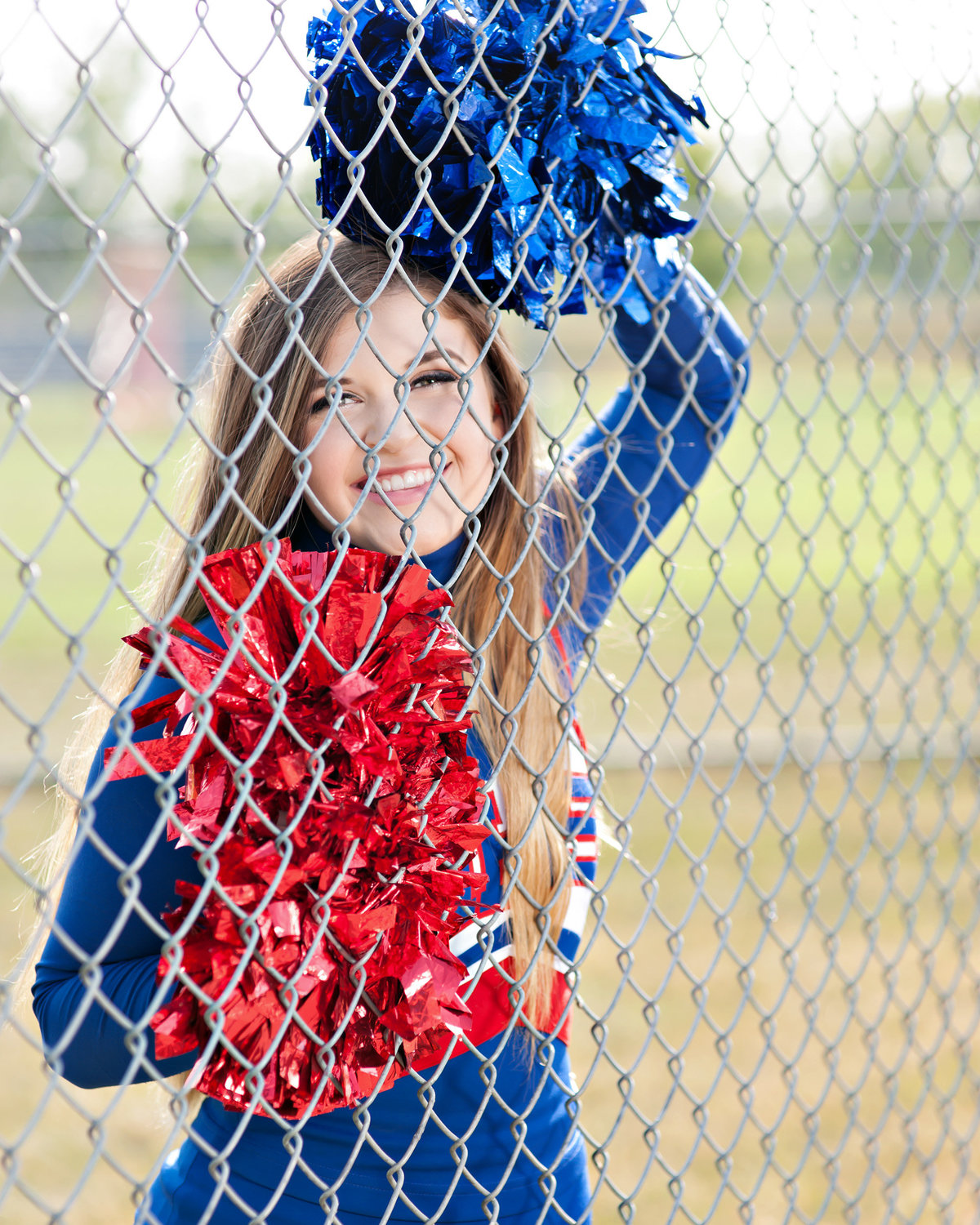 mason michigan senior portraits of cheerleader on football field