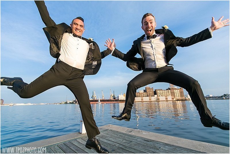 gay grooms jumping for joy in fells point baltimore wedding