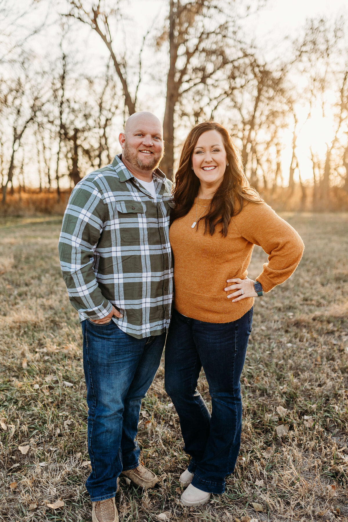 mom and dad pose for a picture