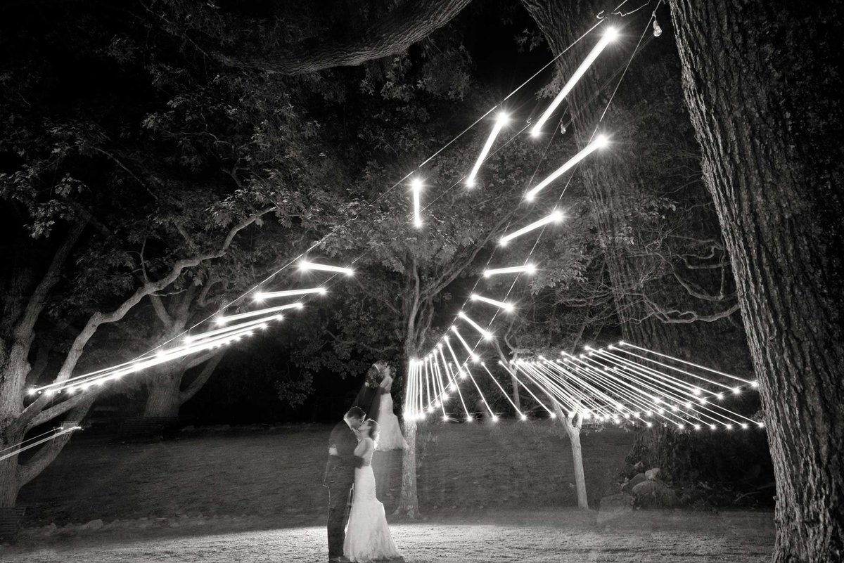 bride and groom under lights at The Ram's Head Inn