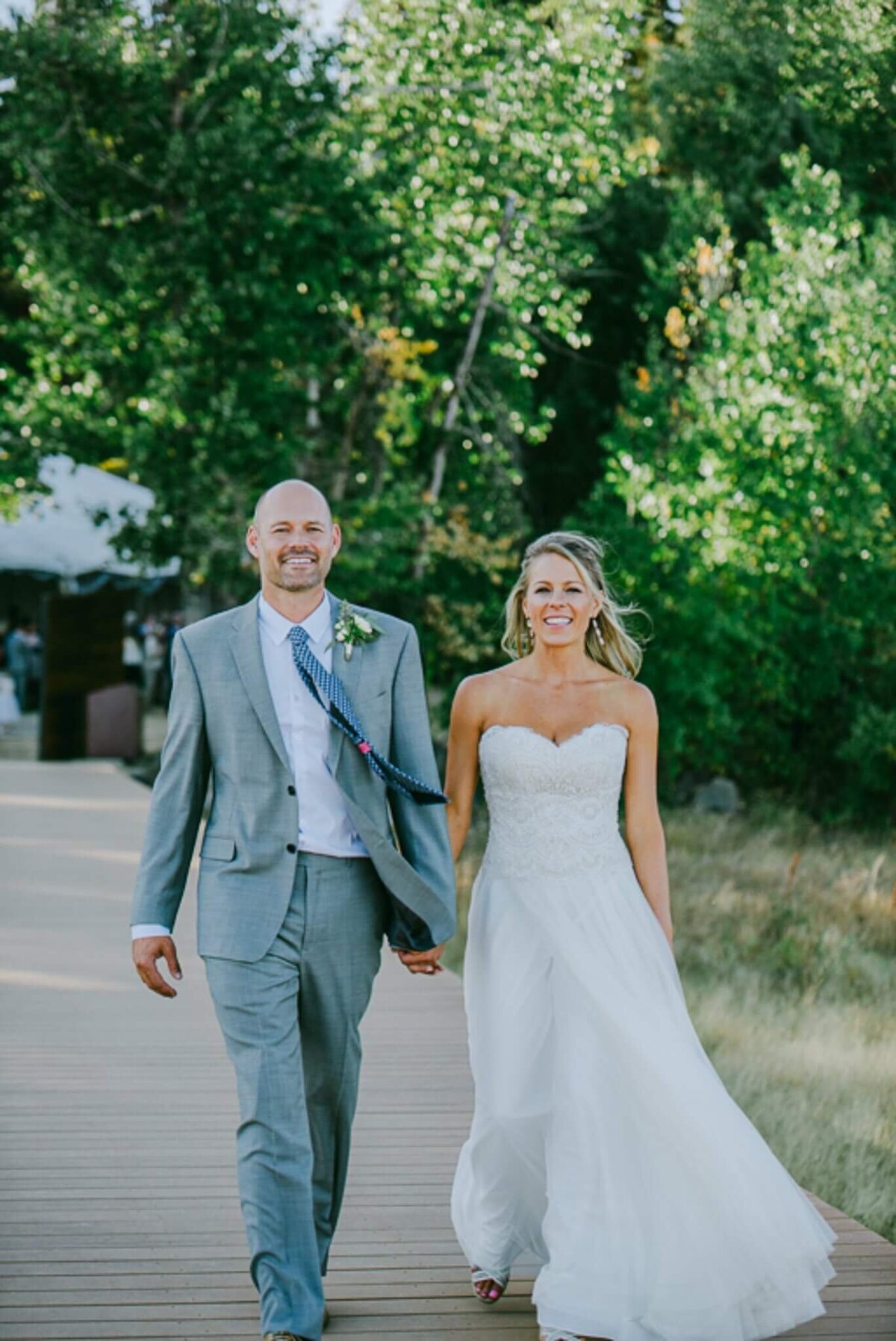 bride and groom on pier in lake tahoe wedding