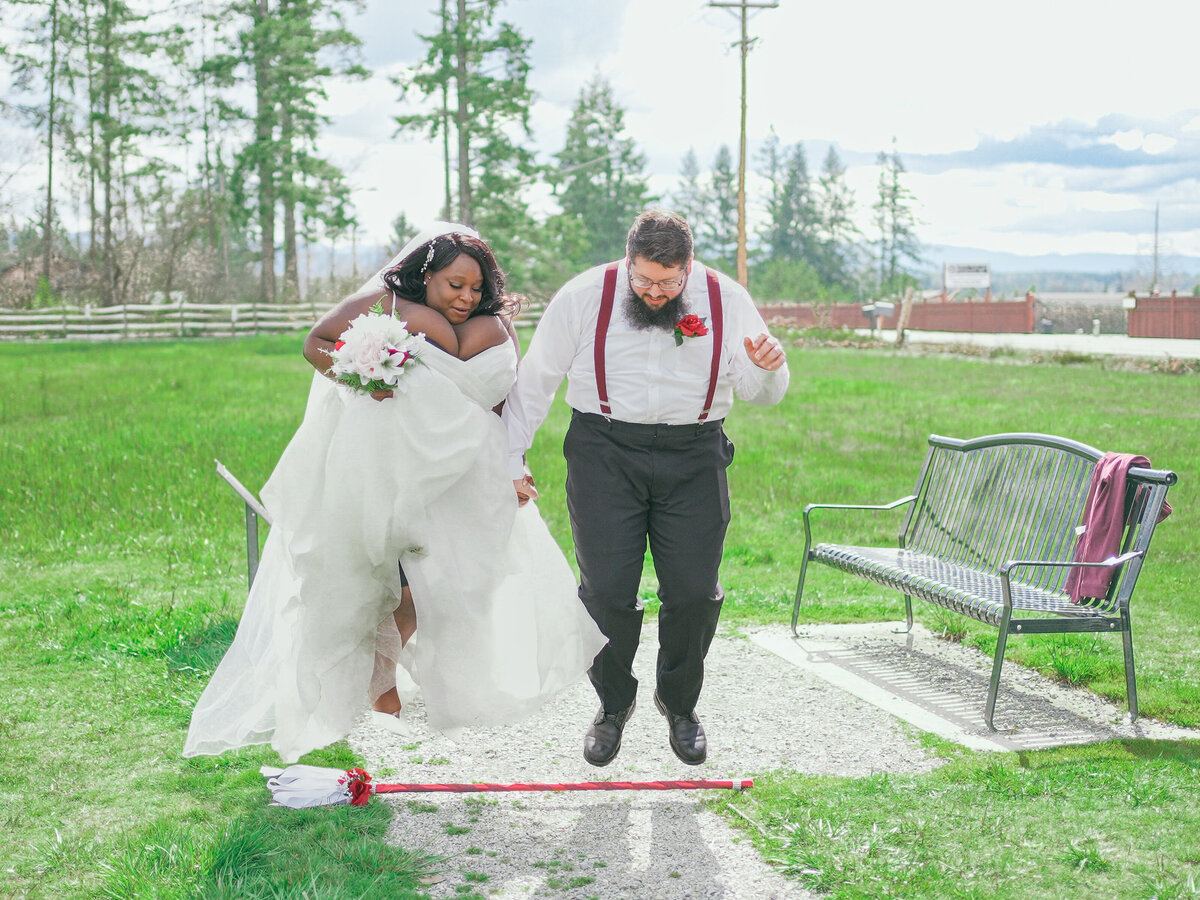 Bride and groom jumping the broom. Sonoma weddings. Photo by 4Karma Studio