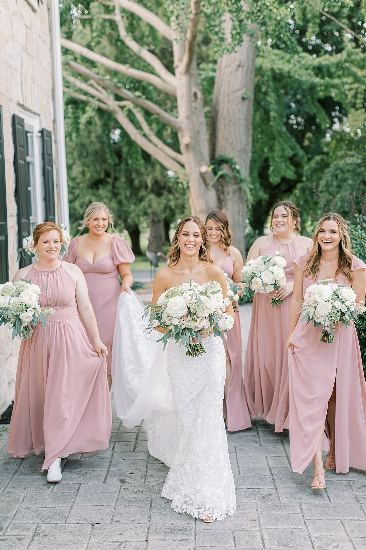 bride with her bridesmaids in pink