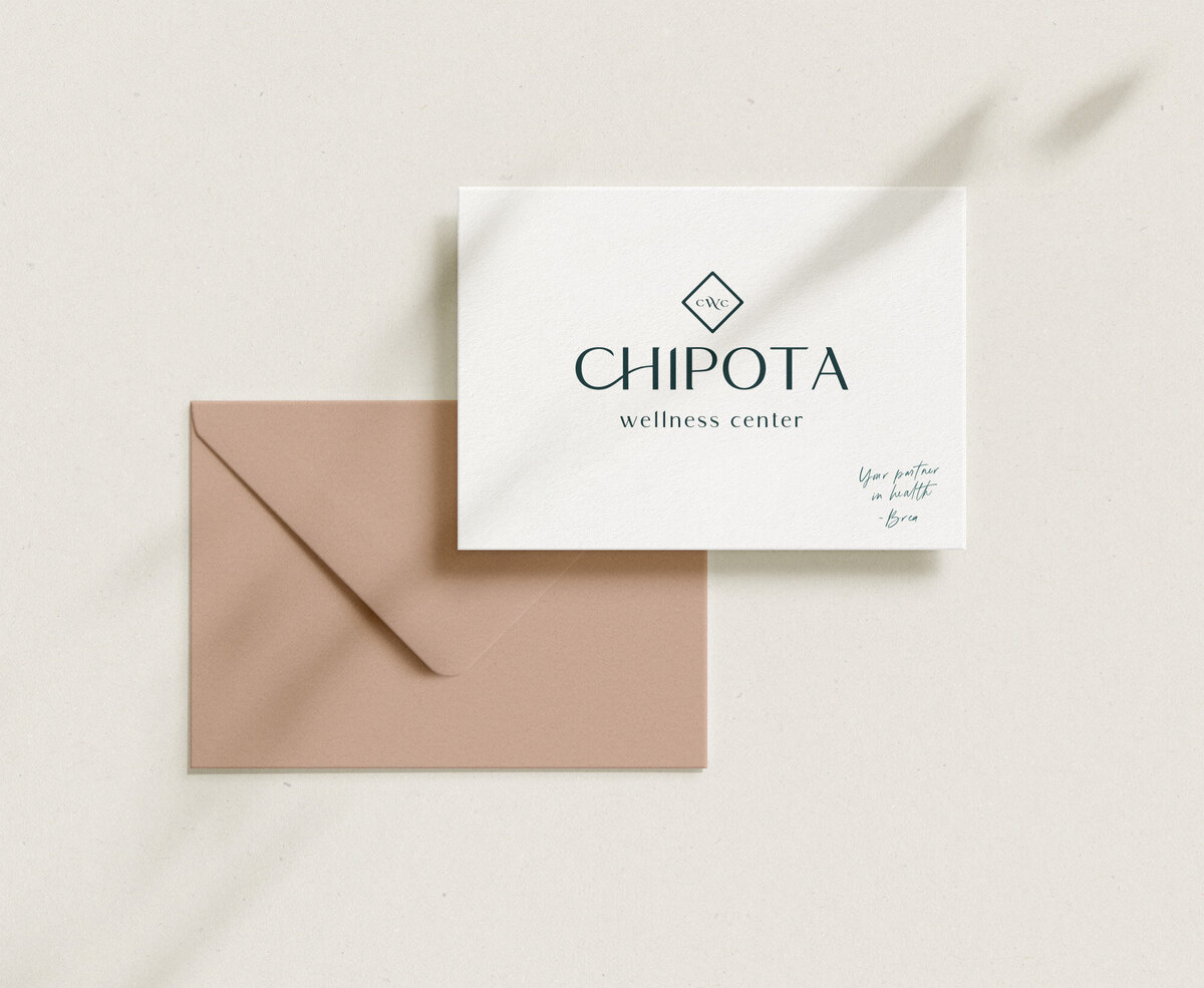 Peach envelope next to a branded note card with primary logo and tagline