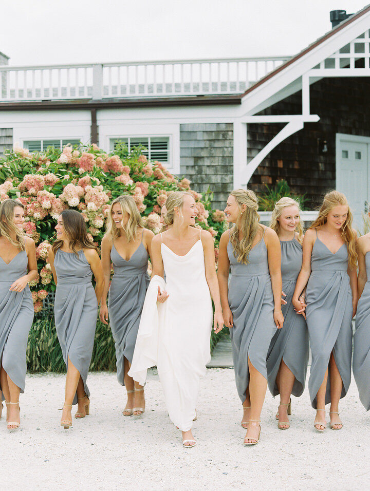 bridesmaids in grey dresses walking at newport castle hill inn
