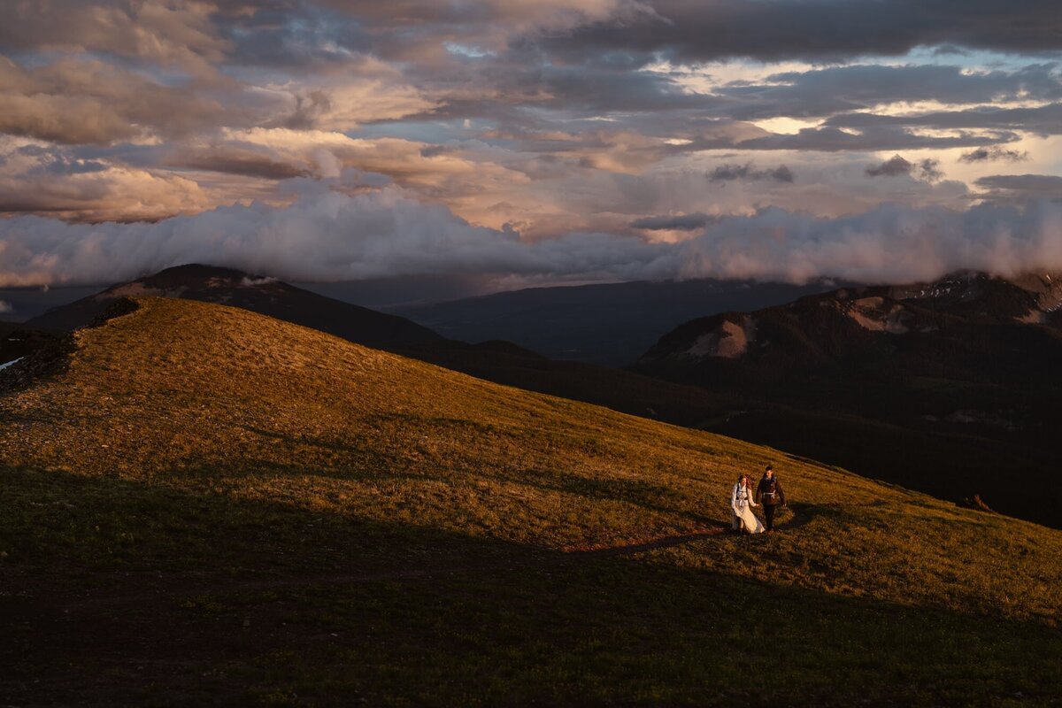 Couple hiking through Crested Butte mountains on their wedding day