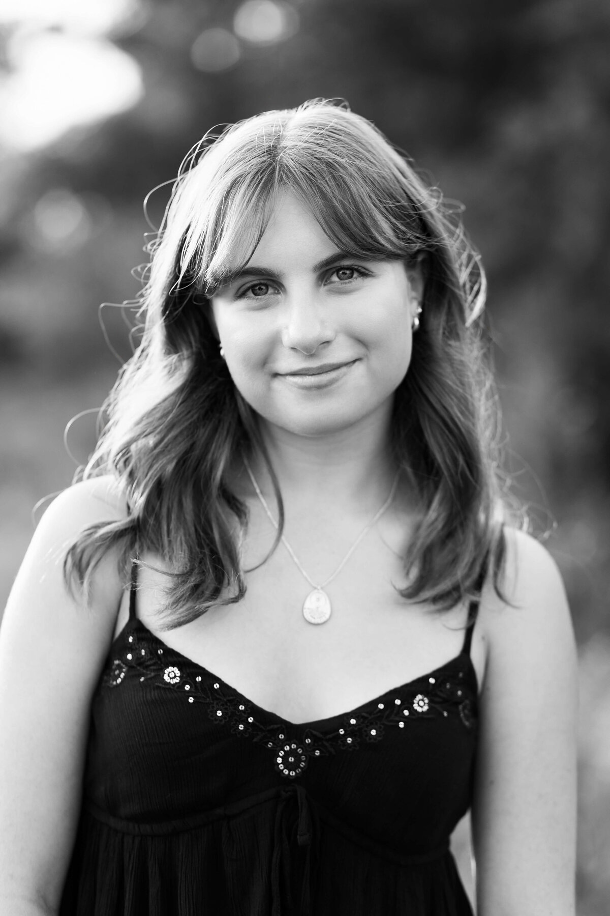 headshot of girl in black and white